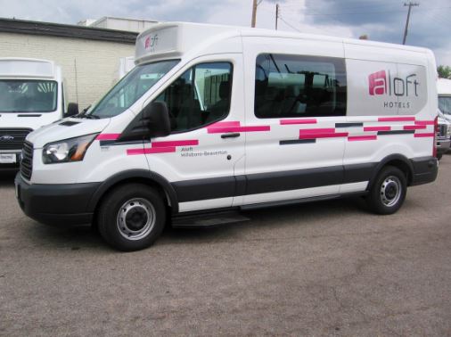 Aloft Hillsboro ShuttleStar Passenger Van With Wrap and ID Sign